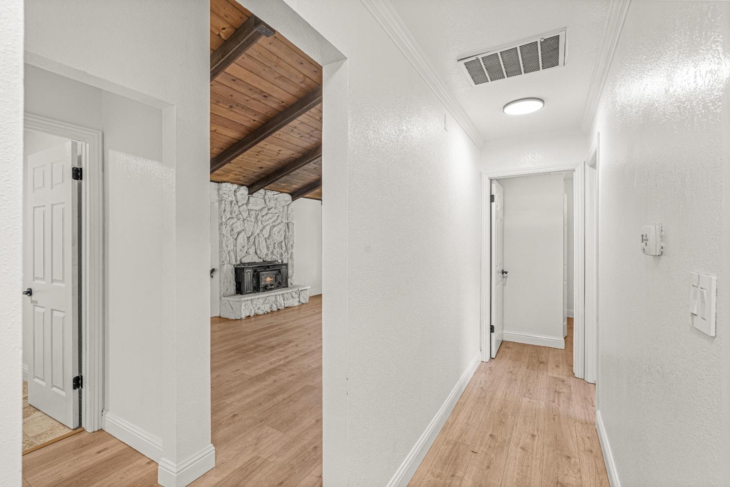 24626 Oro Valley Road Auburn, CA 95602 - Photo 28 of 54 a view of a hallway with wooden floor and entryway