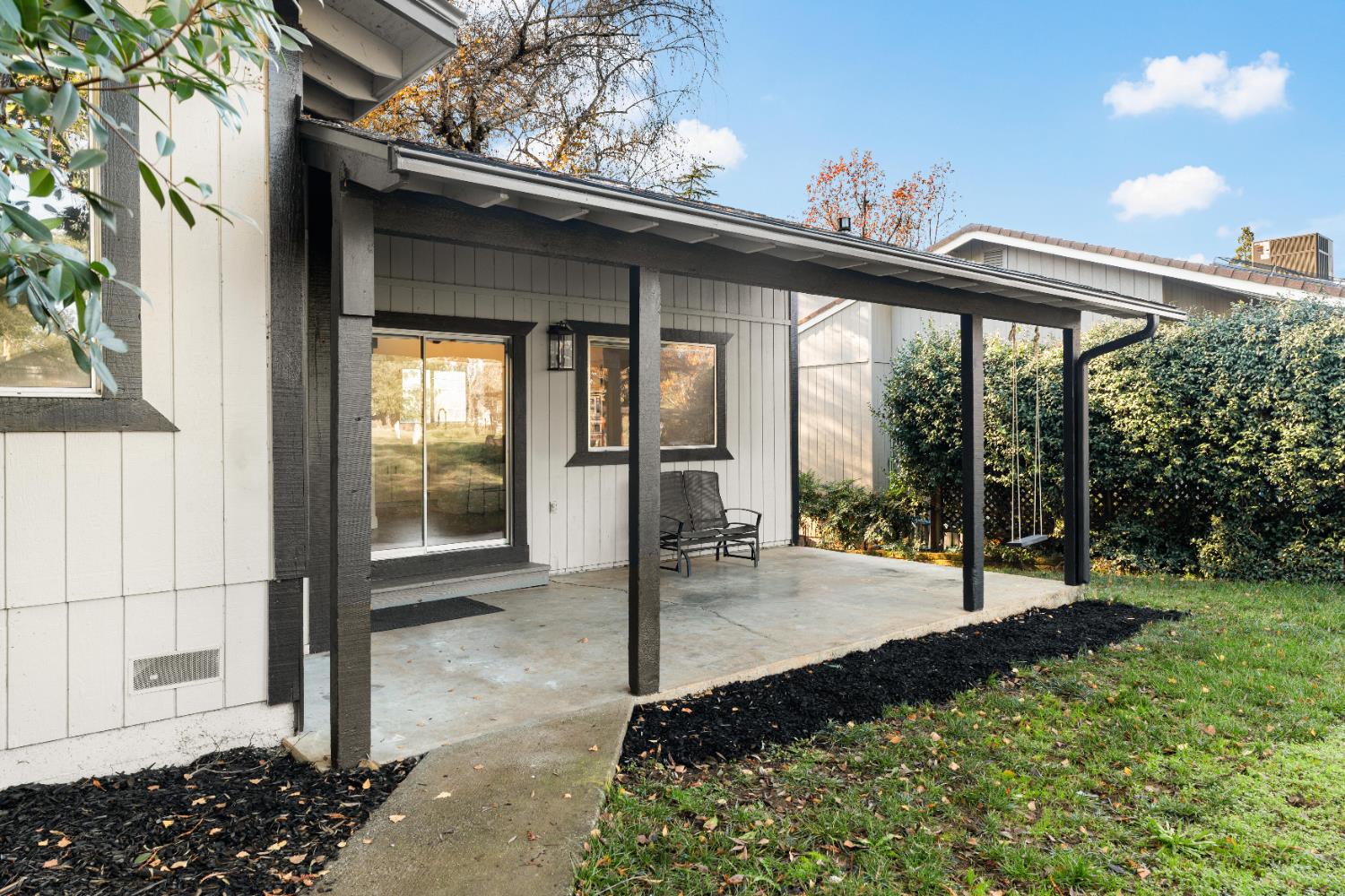 24626 Oro Valley Road Auburn, CA 95602 - Photo 45 of 54 a view of a porch with a backyard