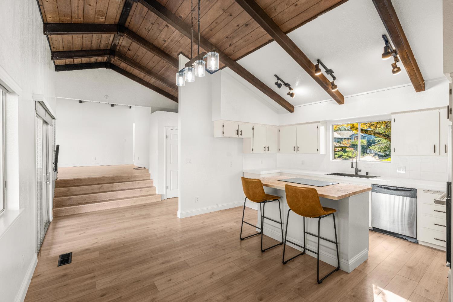 24626 Oro Valley Road Auburn, CA 95602 - Photo 9 of 54 a kitchen with stainless steel appliances granite countertop a sink and wooden floors
