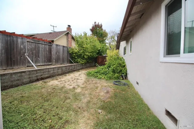 a backyard of a house with lots of green space