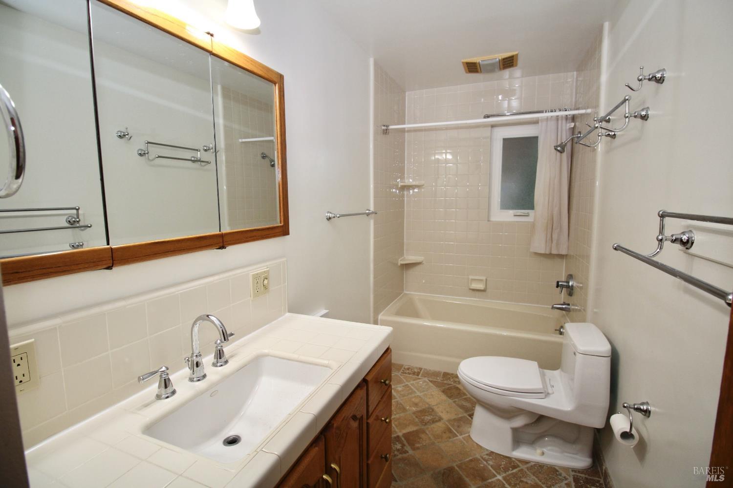 599 Tamarack Drive San Rafael, CA 94903 - Photo 20 of 20 a bathroom with a sink a toilet and shower