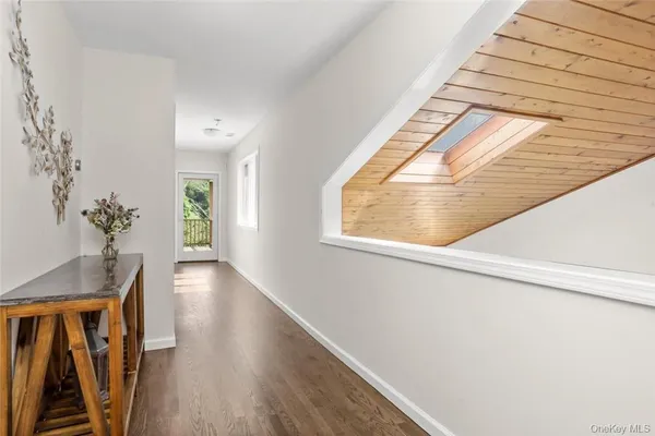 a view of an entryway with wooden floor