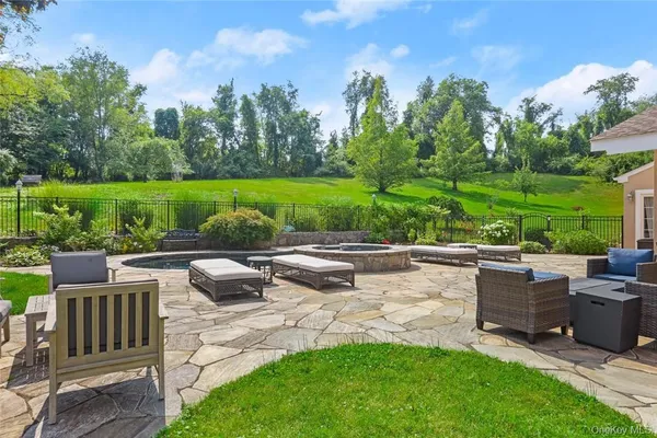 a view of a swimming pool with a patio