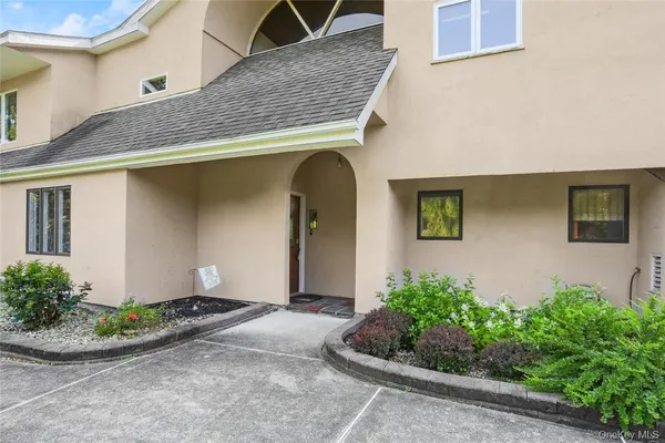 a front view of a house with garage