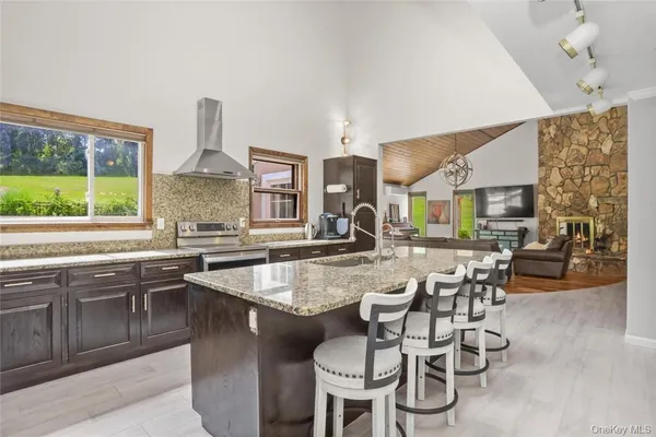a large kitchen with a table and chairs in it