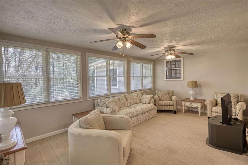 2740 Dennard Road Northeast Conyers, GA 30013 - Photo 18 of 51 a living room with furniture and a large window