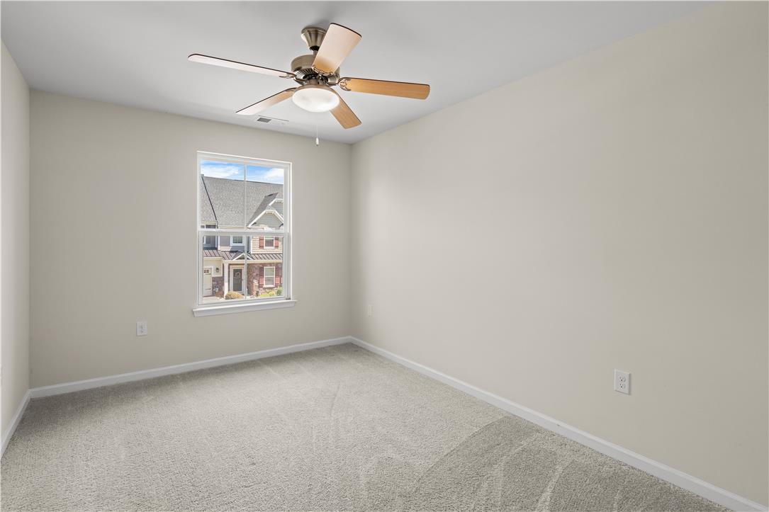 4758 Rafi Road Easton, PA 18045 - Photo 30 of 55 A well-lit bedroom features plush carpeting and a ceiling fan for comfort.