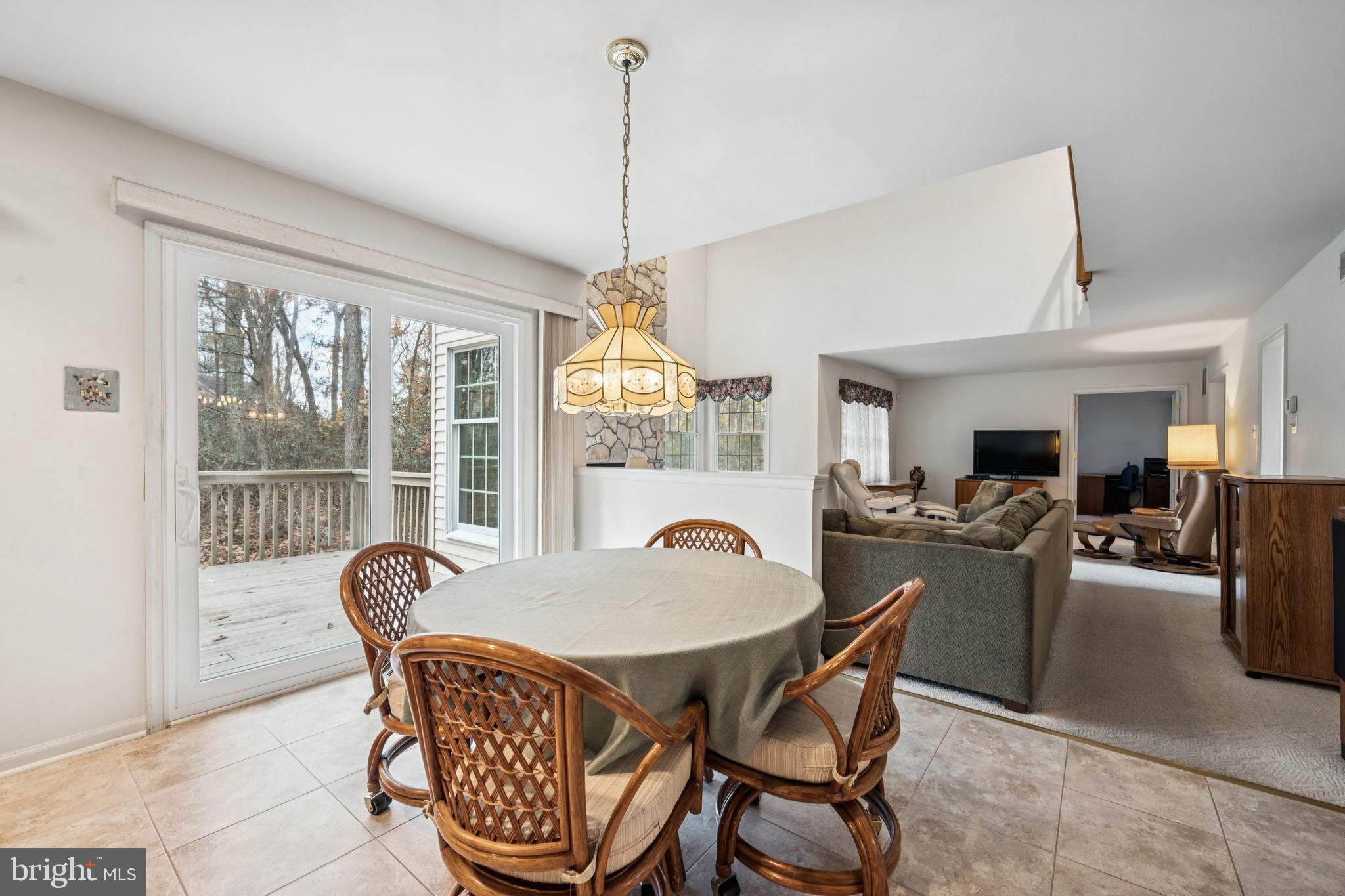 32 Constitution Drive Southampton, NJ 08088 - Photo 12 of 31 a dining room with furniture a chandelier and wooden floor
