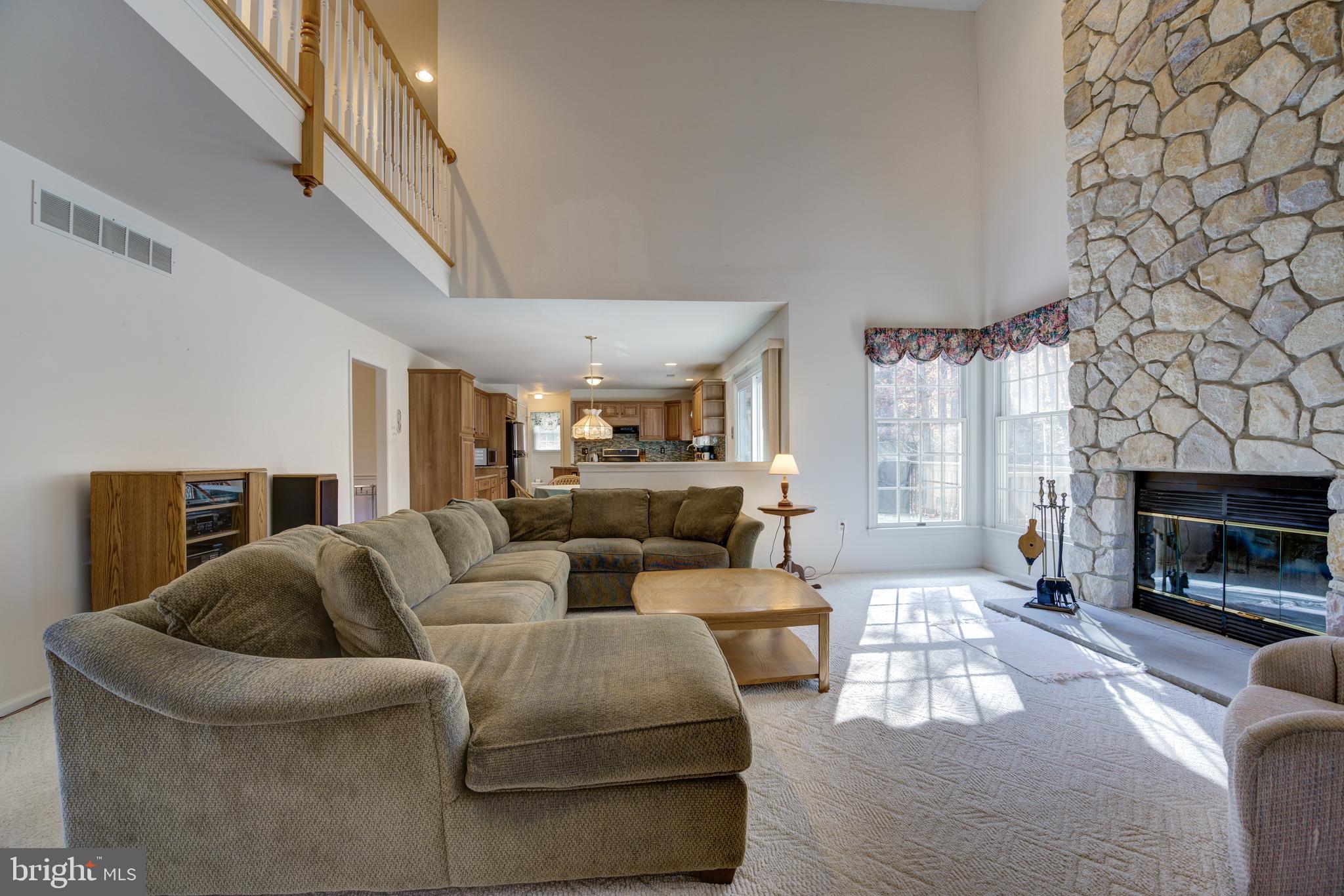 32 Constitution Drive Southampton, NJ 08088 - Photo 13 of 31 a living room with furniture and a fireplace