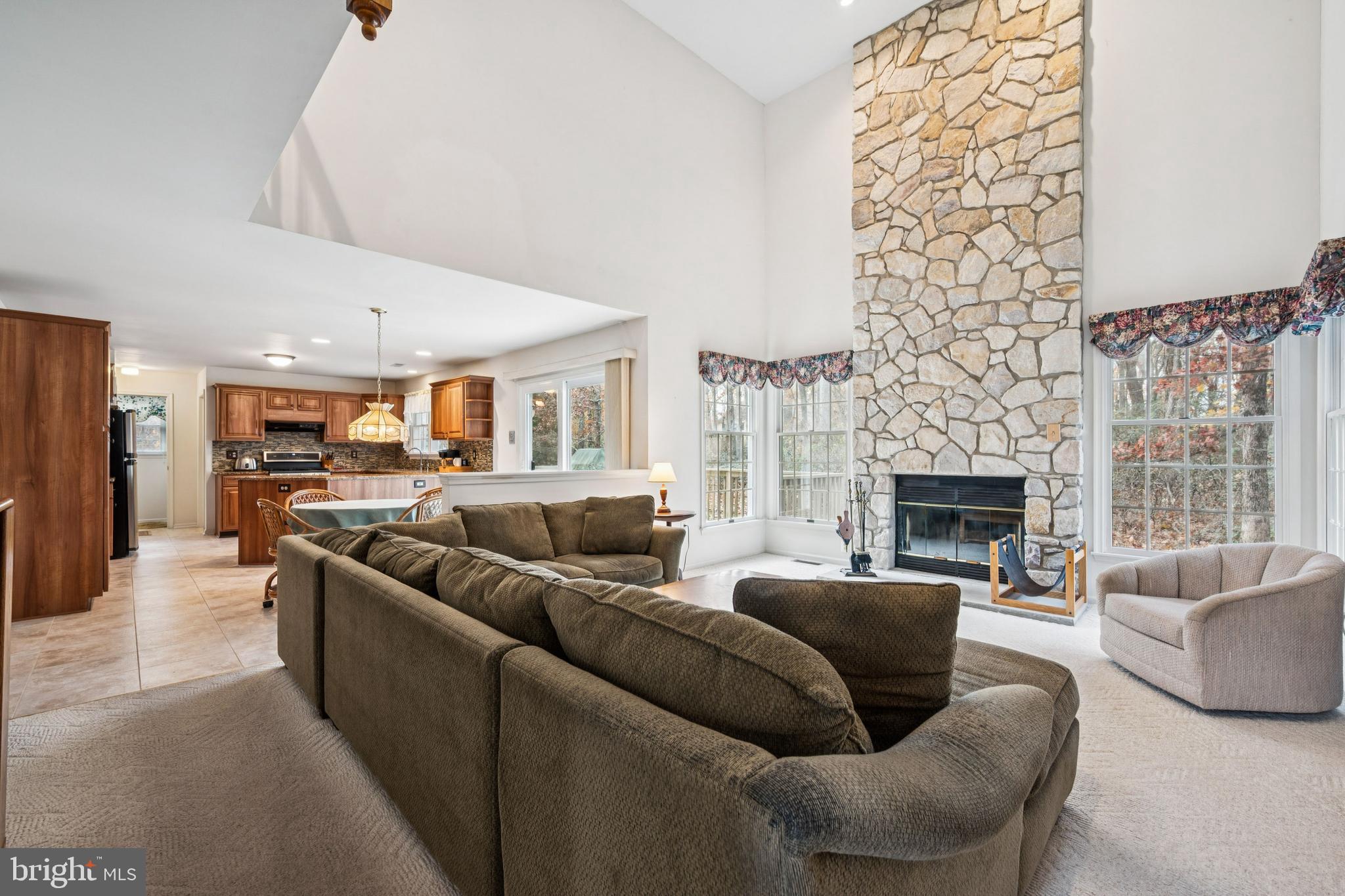 32 Constitution Drive Southampton, NJ 08088 - Photo 16 of 31 a living room with furniture and a fireplace