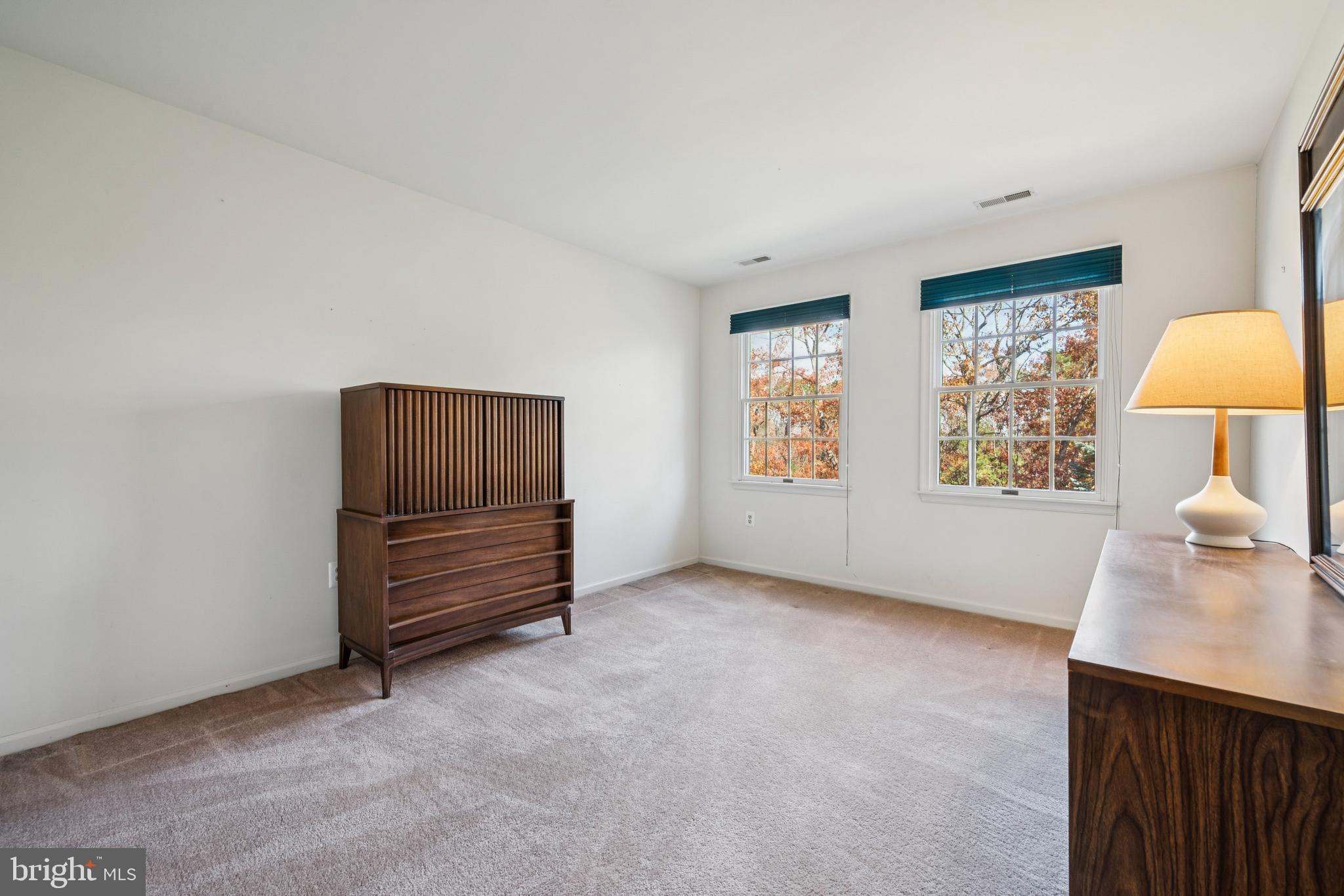 32 Constitution Drive Southampton, NJ 08088 - Photo 25 of 31 an empty room with windows and cabinet