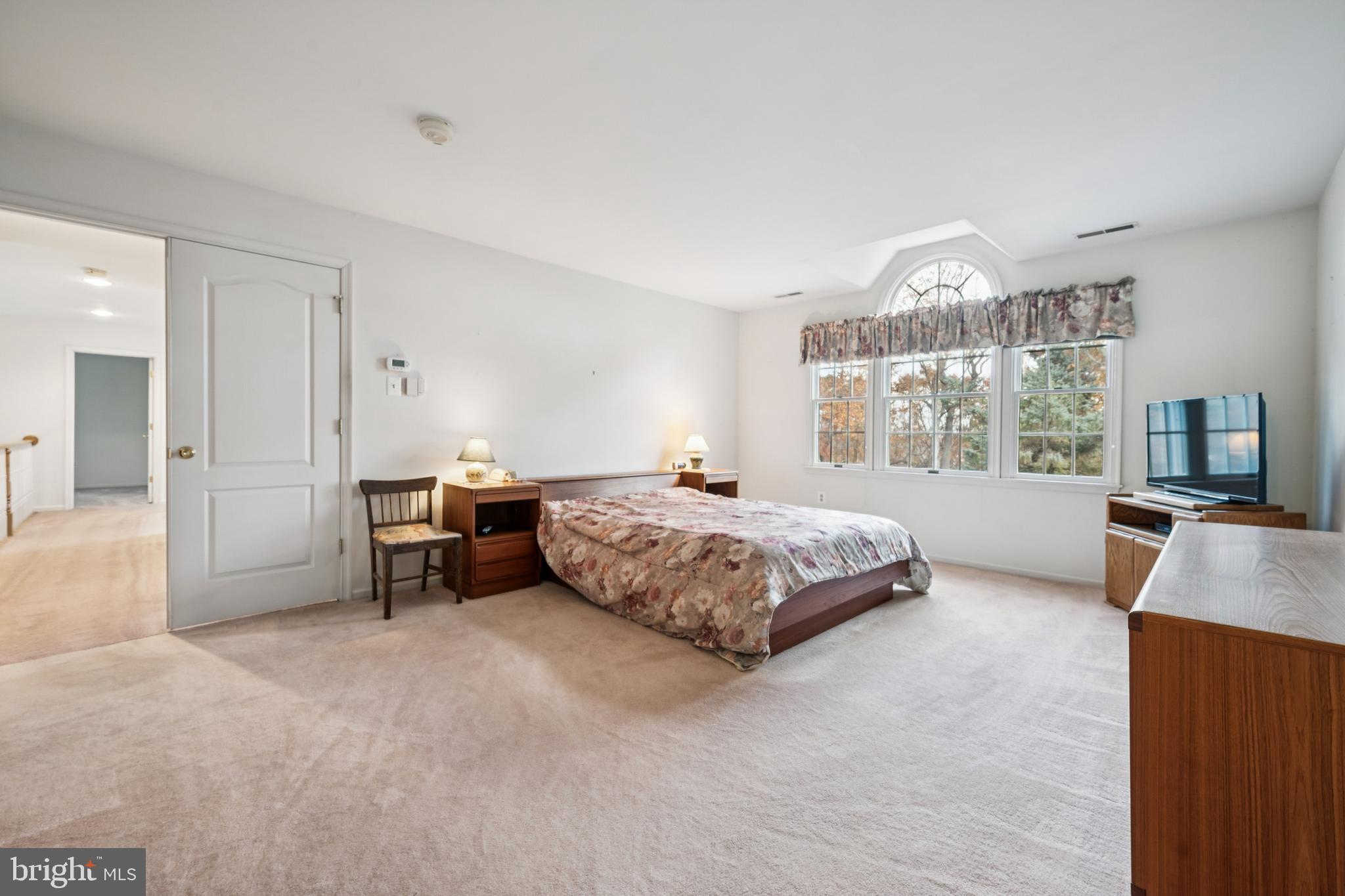 32 Constitution Drive Southampton, NJ 08088 - Photo 26 of 31 a bedroom with a large bed and a tv