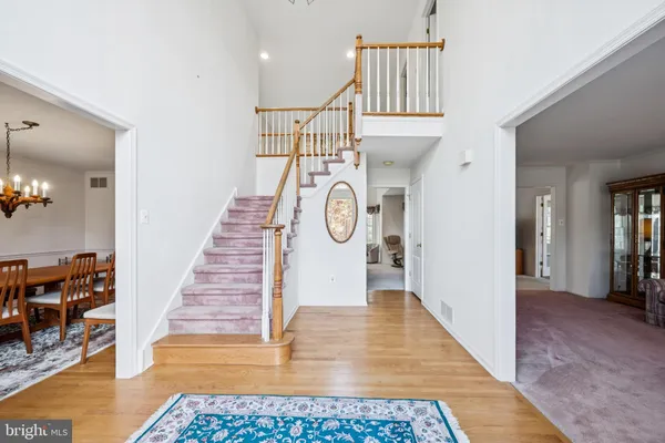 a view of entryway with wooden floor