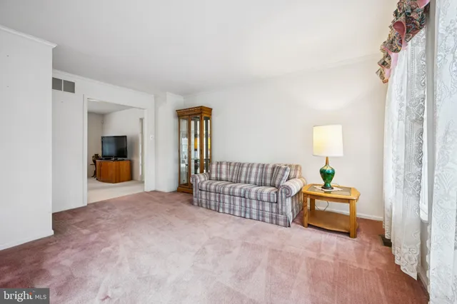 a bedroom with furniture and wooden floor