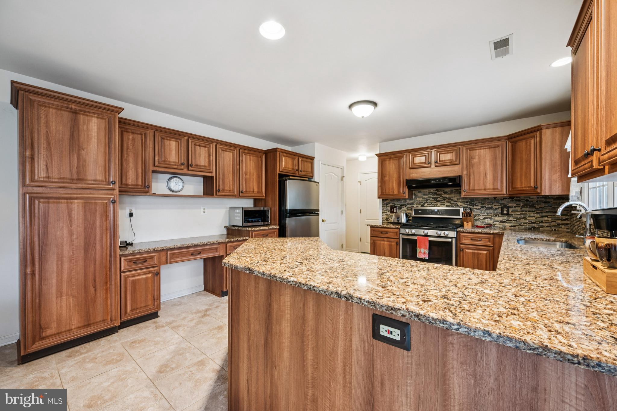 32 Constitution Drive Southampton, NJ 08088 - Photo 9 of 31 a kitchen with stainless steel appliances granite countertop a refrigerator stove top oven a sink and dishwasher