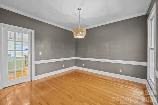 a bathroom with a window and a shower