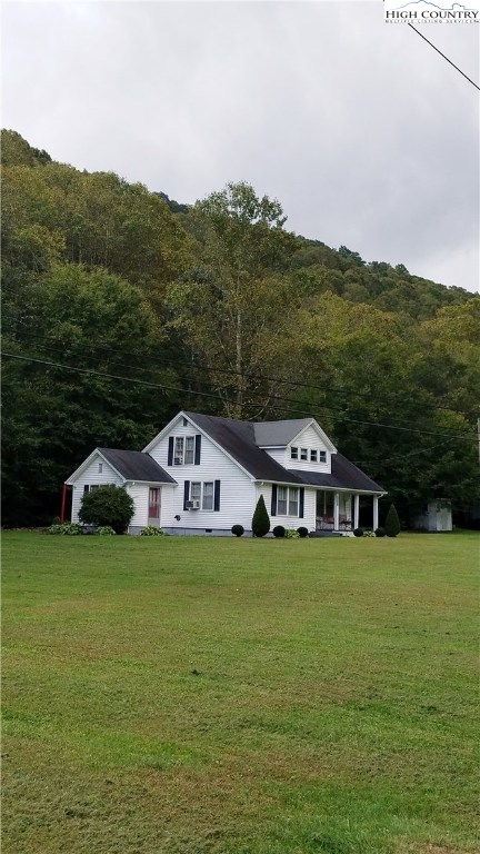 2403 Meat Camp Road Boone, NC 28607 - Photo 3 of 40 a view of a house with a garden and yard