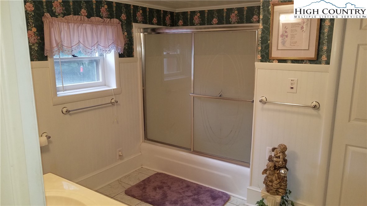 2403 Meat Camp Road Boone, NC 28607 - Photo 35 of 40 a bathroom with a bathtub and shower