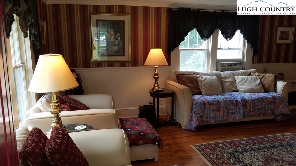 2403 Meat Camp Road Boone, NC 28607 - Photo 8 of 40 a living room with furniture and a window