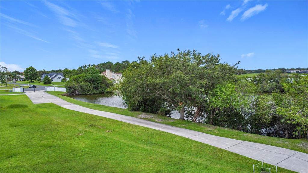 2959 Monica Terrace Kissimmee, FL 34744 - Photo 8 of 23 a view of a golf course with a lake