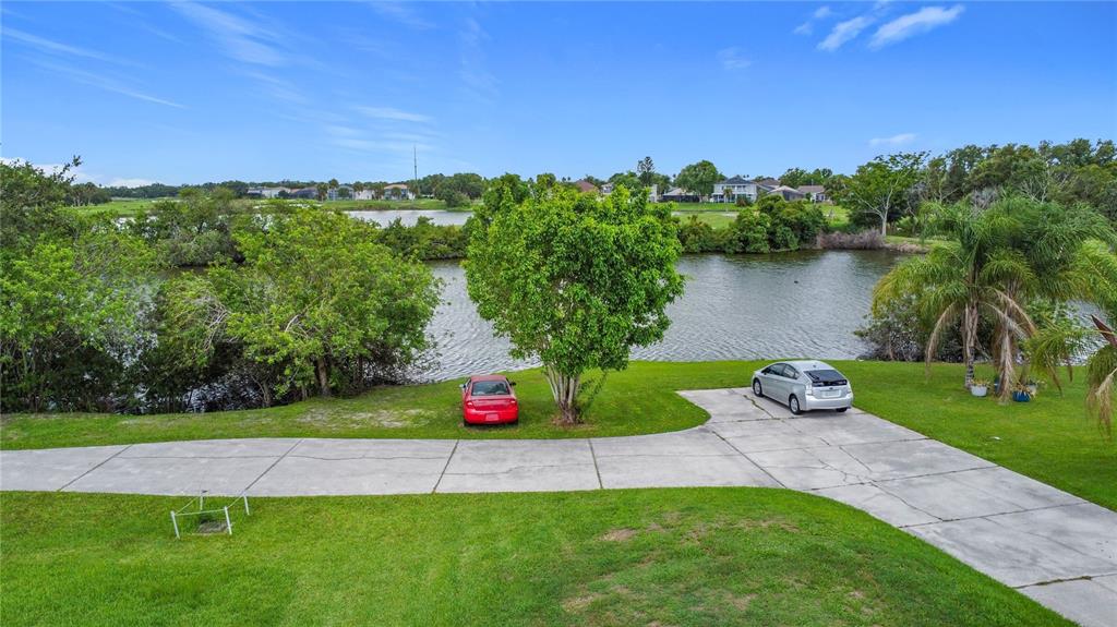 2959 Monica Terrace Kissimmee, FL 34744 - Photo 9 of 23 a view of a garden with a lake