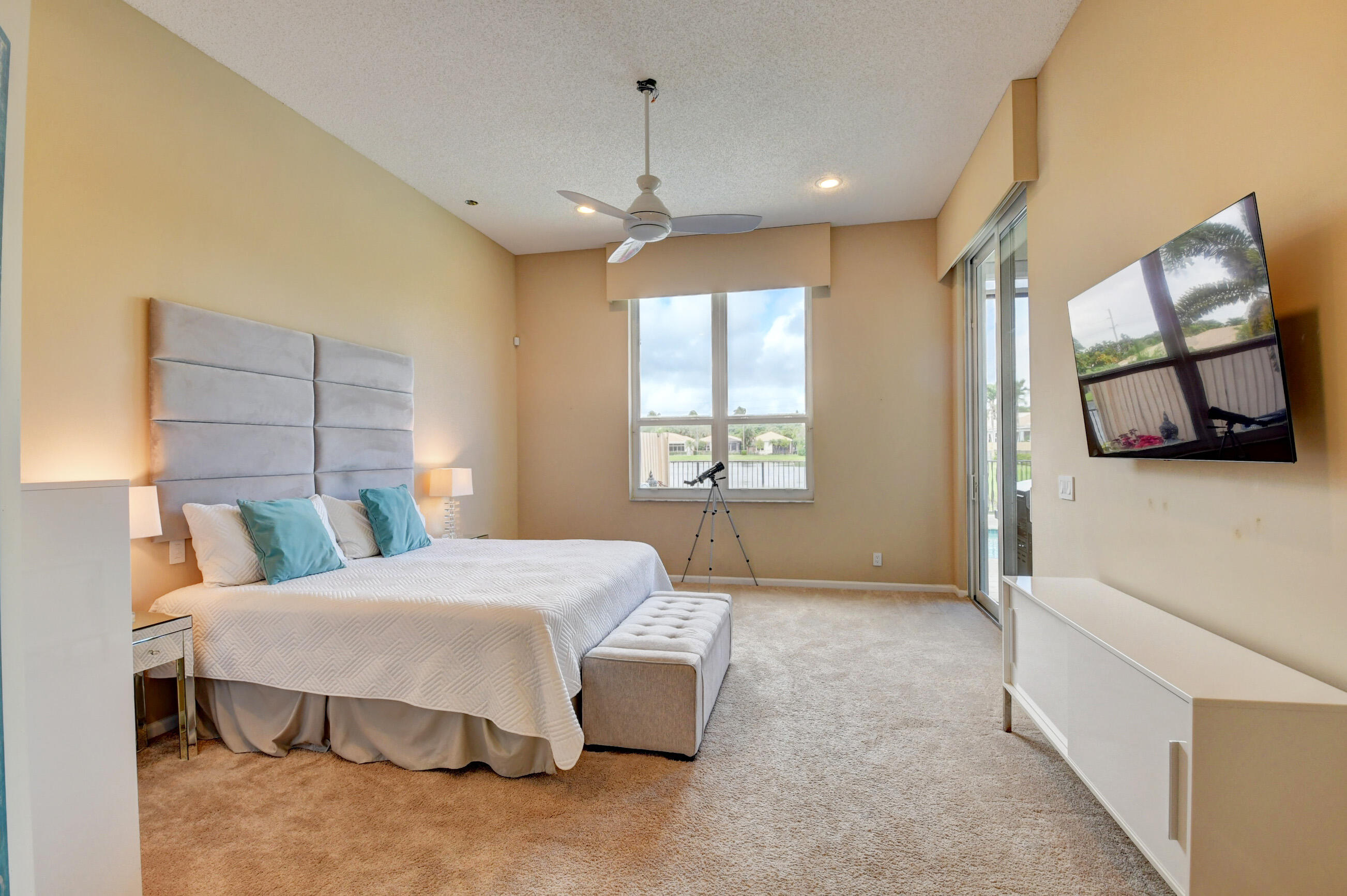 2331 Northwest 66th Drive Boca Raton, FL 33496 - Photo 24 of 71 a bedroom with a bed mirror and window