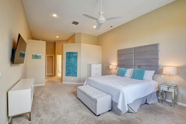 a bedroom with furniture and a window