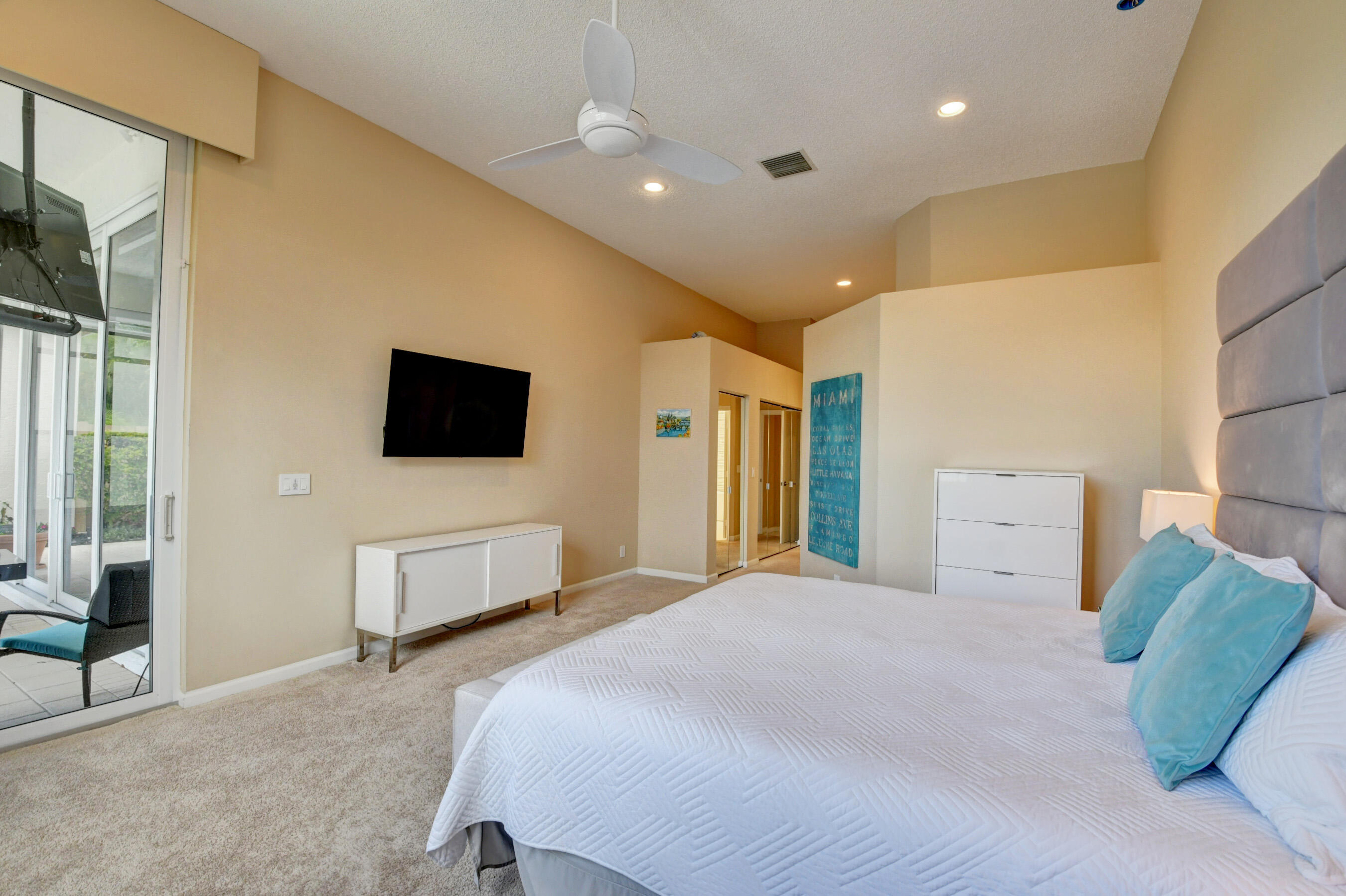 2331 Northwest 66th Drive Boca Raton, FL 33496 - Photo 26 of 71 a bedroom with a bed and a television