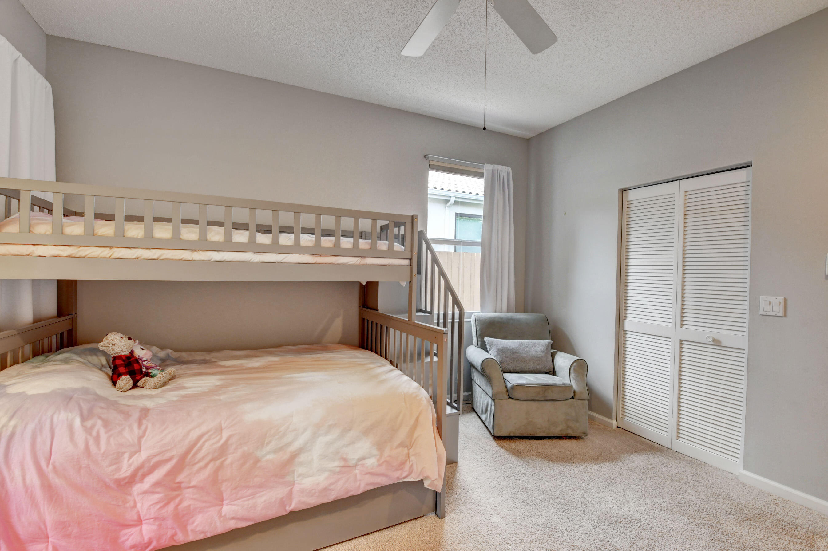 2331 Northwest 66th Drive Boca Raton, FL 33496 - Photo 32 of 71 a bedroom with a bed and a mirror