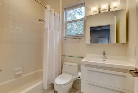 a view of a dining room with furniture wooden floor and chandelier