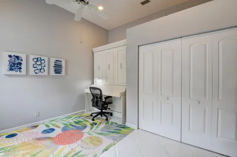 a view of a patio with table and chairs and potted plants