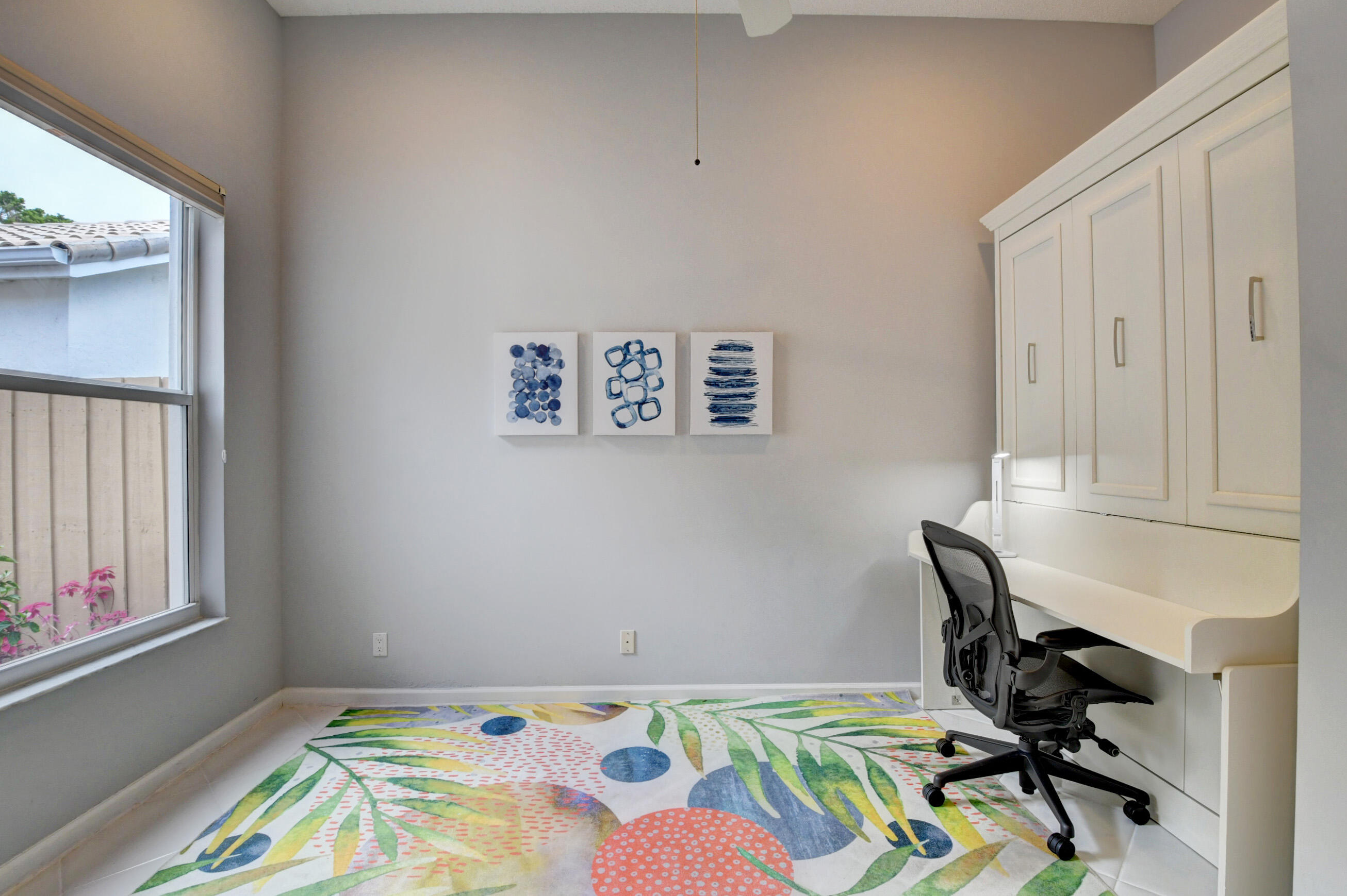 2331 Northwest 66th Drive Boca Raton, FL 33496 - Photo 35 of 71 a bedroom with a bed and a table in it