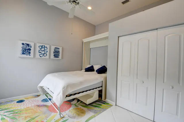 a view of a house with backyard sitting area and garden