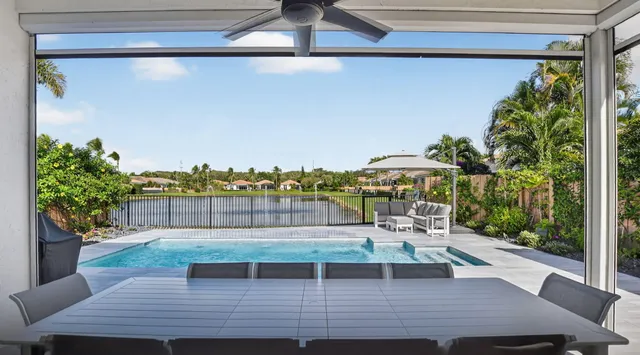a view of a backyard with a patio and plants