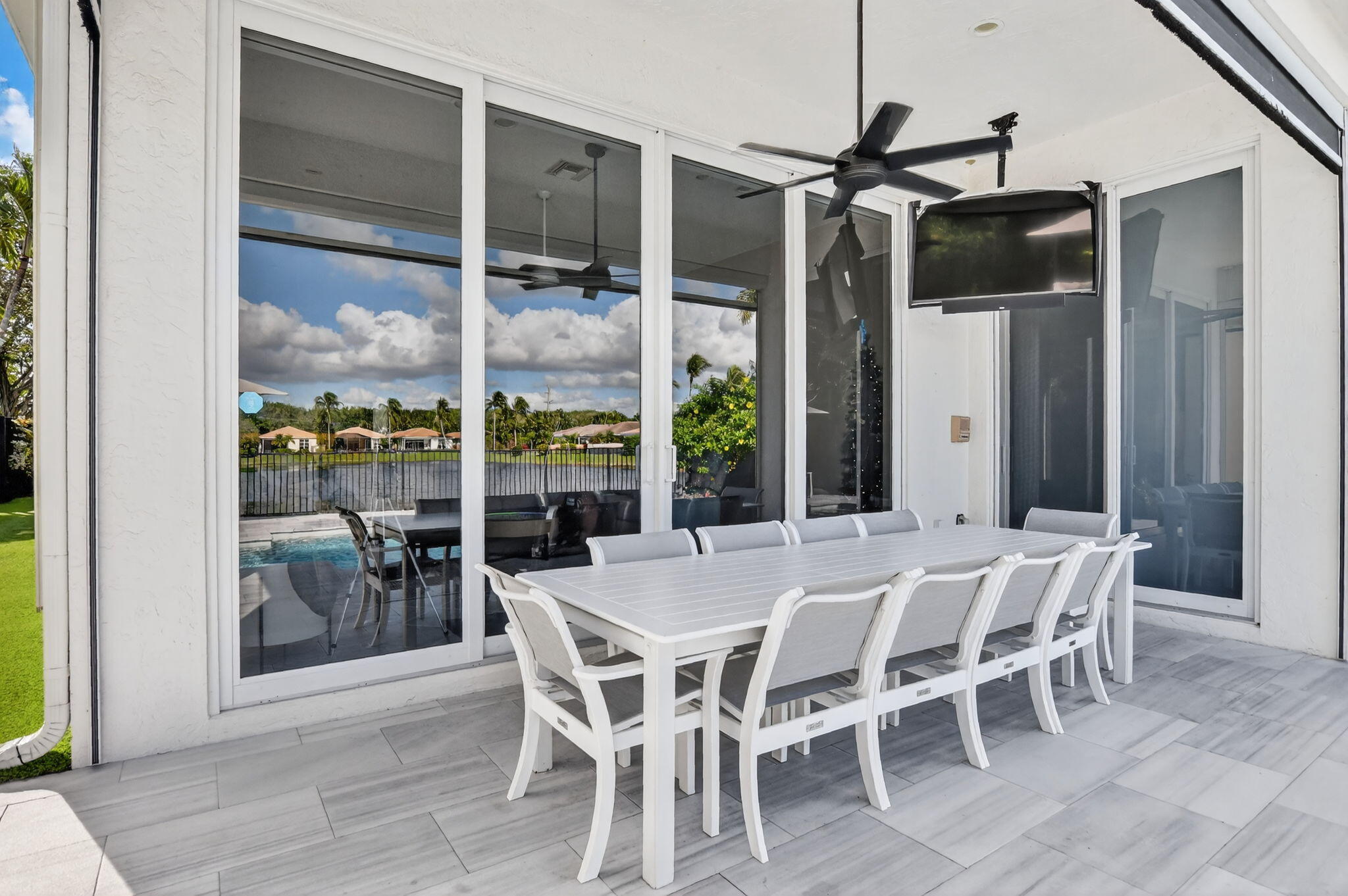 2331 Northwest 66th Drive Boca Raton, FL 33496 - Photo 40 of 71 a view of a dining room with furniture wooden floor and chandelier