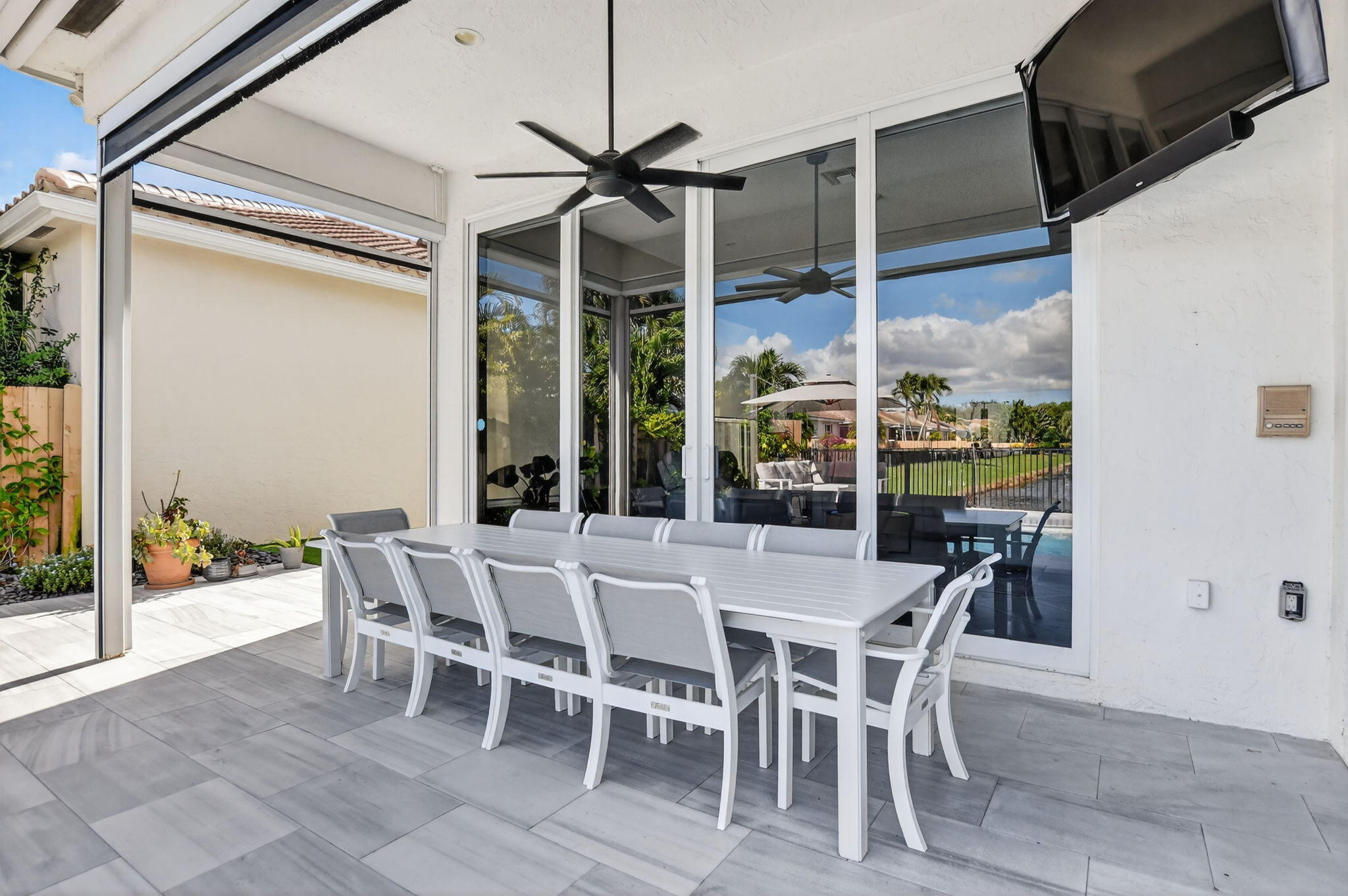 2331 Northwest 66th Drive Boca Raton, FL 33496 - Photo 41 of 71 a view of a dining room with furniture wooden floor and chandelier