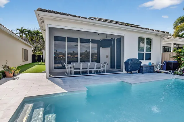 an aerial view of a house with a big yard