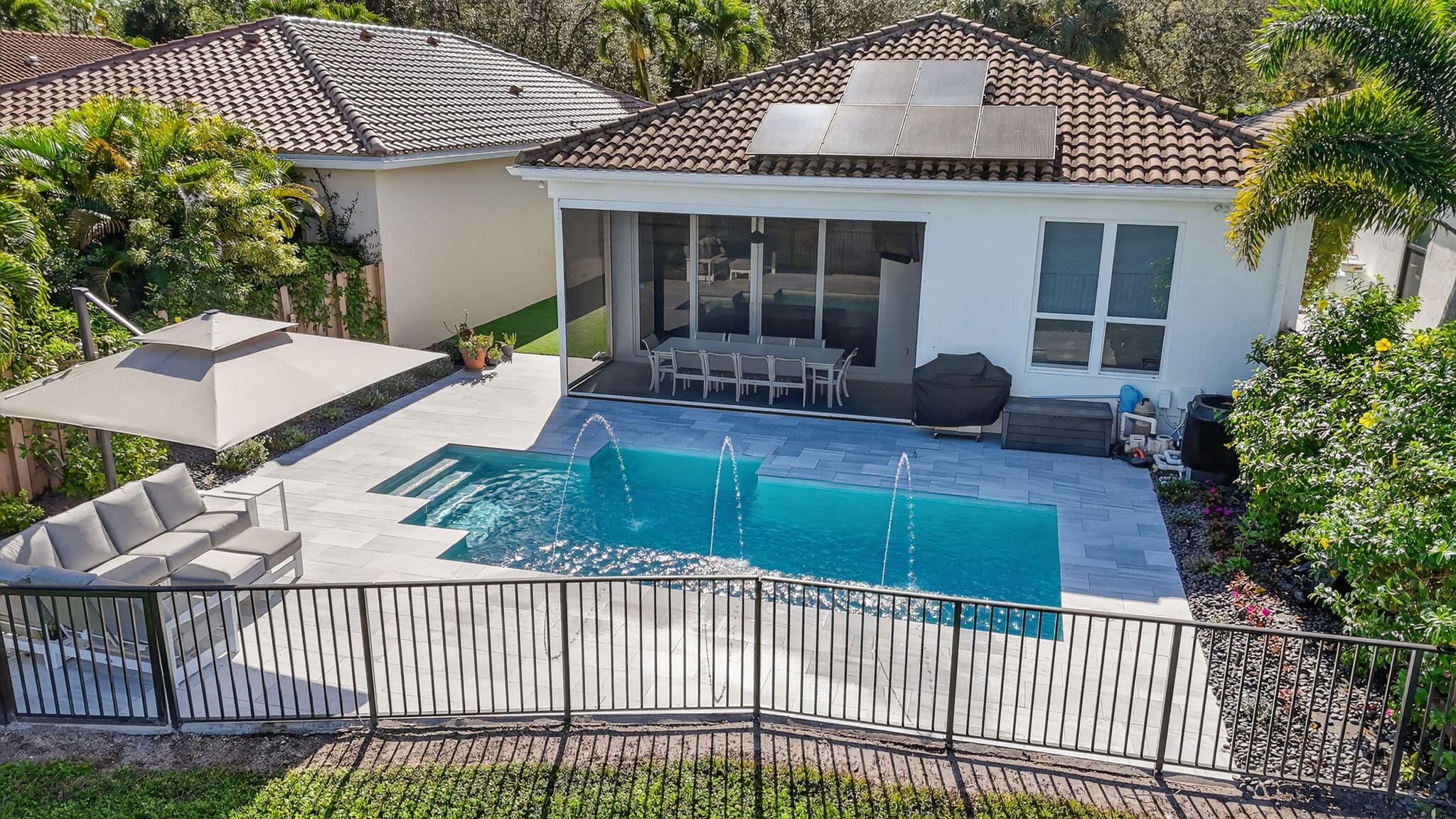 2331 Northwest 66th Drive Boca Raton, FL 33496 - Photo 55 of 71 a front view of a house with garden