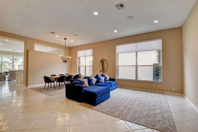 a kitchen with granite countertop a sink and white cabinets