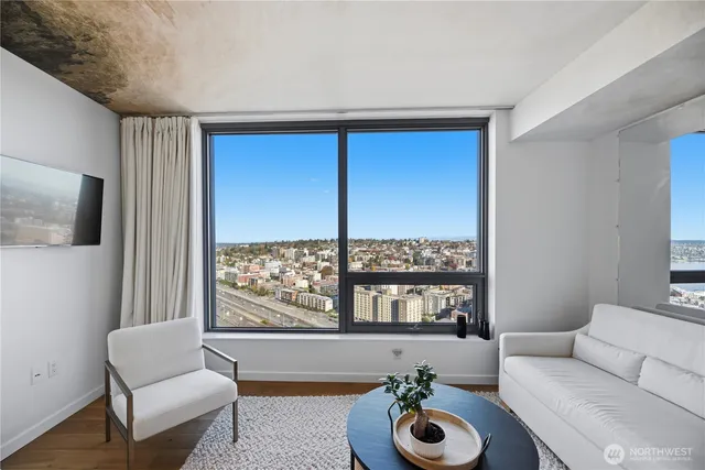 a living room with furniture and a large window