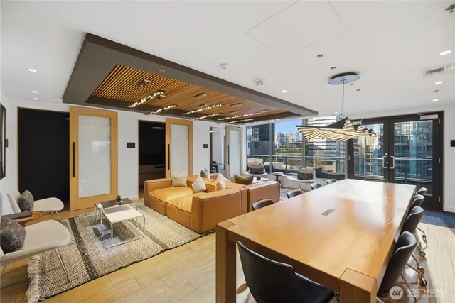 a balcony with furniture and a large window