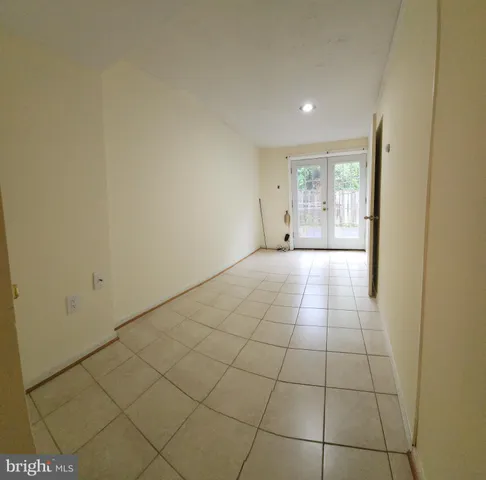 a view of an empty room and wooden floor