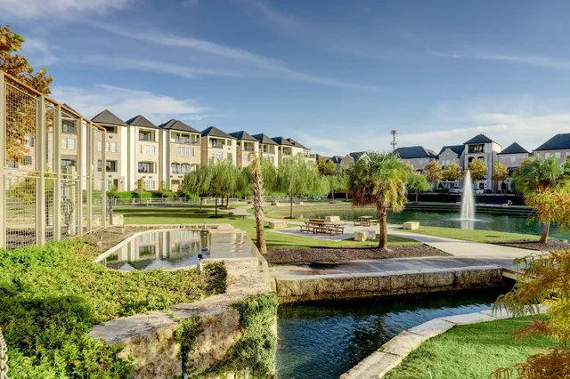 a view of a house with swimming pool and a chairs