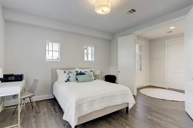 a bedroom with a bed and a table in it