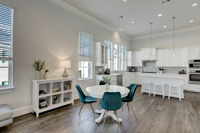 a view of kitchen with dining table and chairs