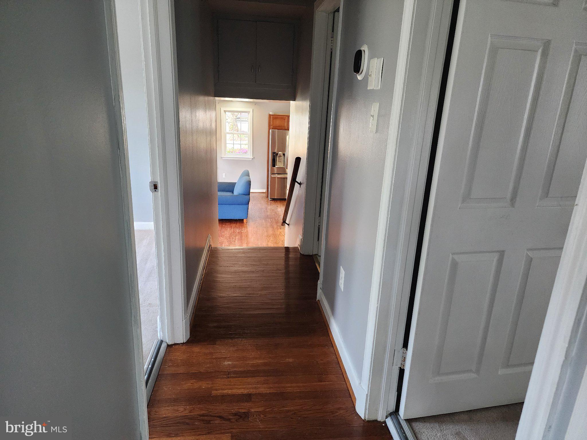 13 Main Street Huntingtown, MD 20639 - Photo 11 of 32 Inviting hallway leads to cozy living space.
