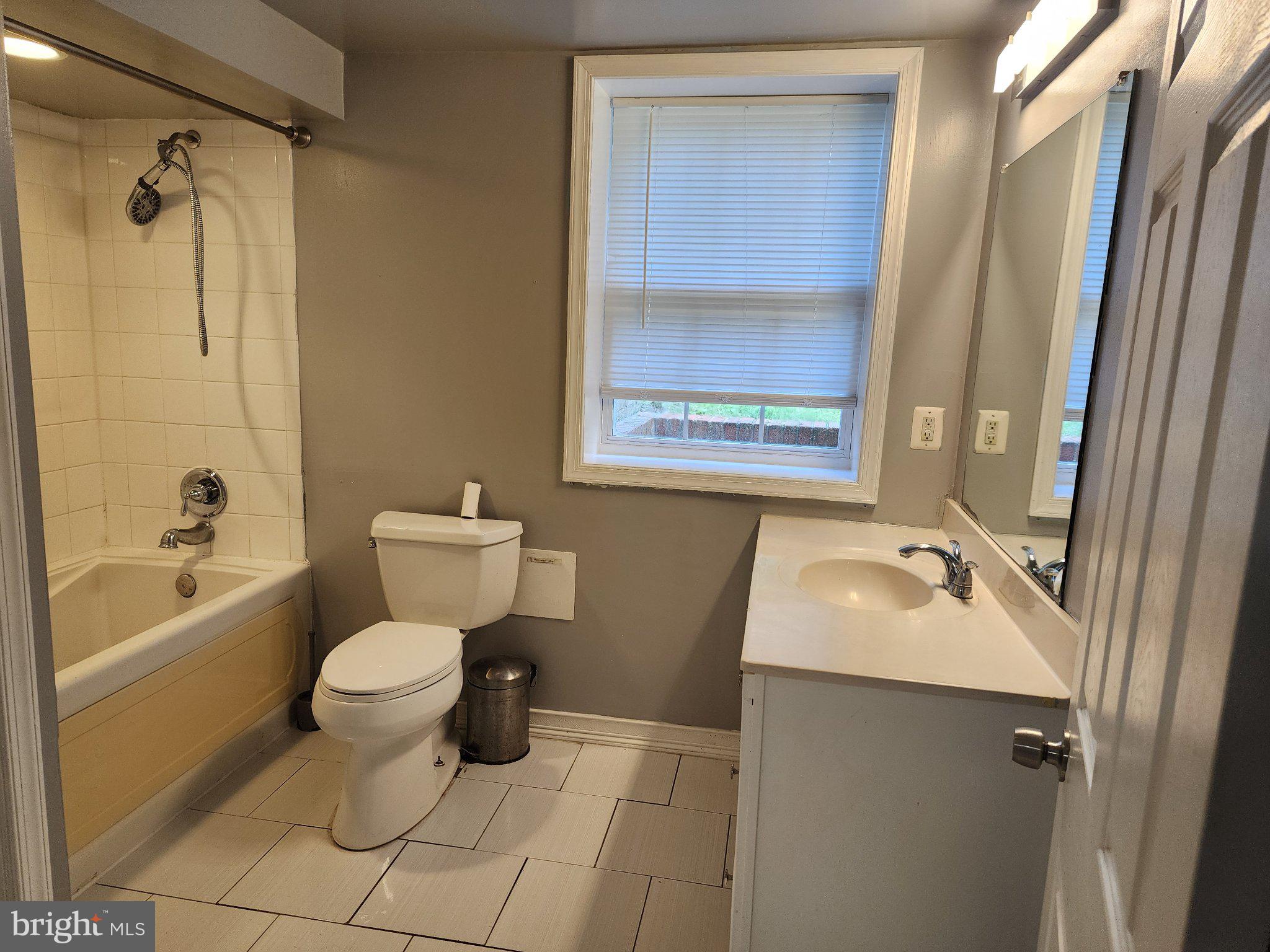 13 Main Street Huntingtown, MD 20639 - Photo 16 of 32 Modern bathroom with natural light.