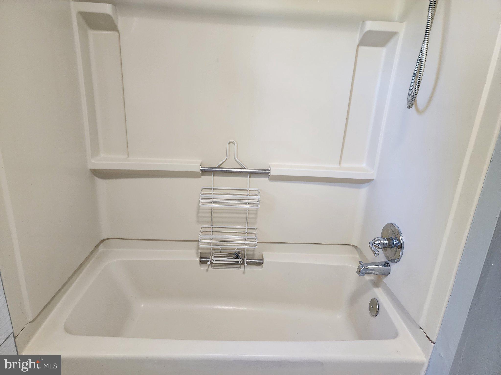 13 Main Street Huntingtown, MD 20639 - Photo 18 of 32 Sleek and modern bathtub design.