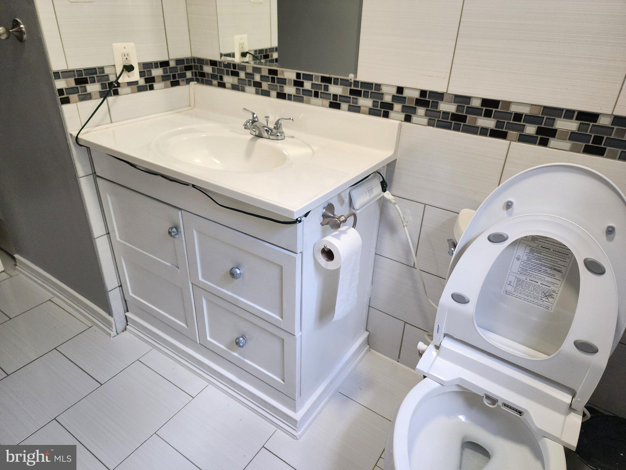 13 Main Street Huntingtown, MD 20639 - Photo 20 of 32 Modern bathroom with sleek finishes.