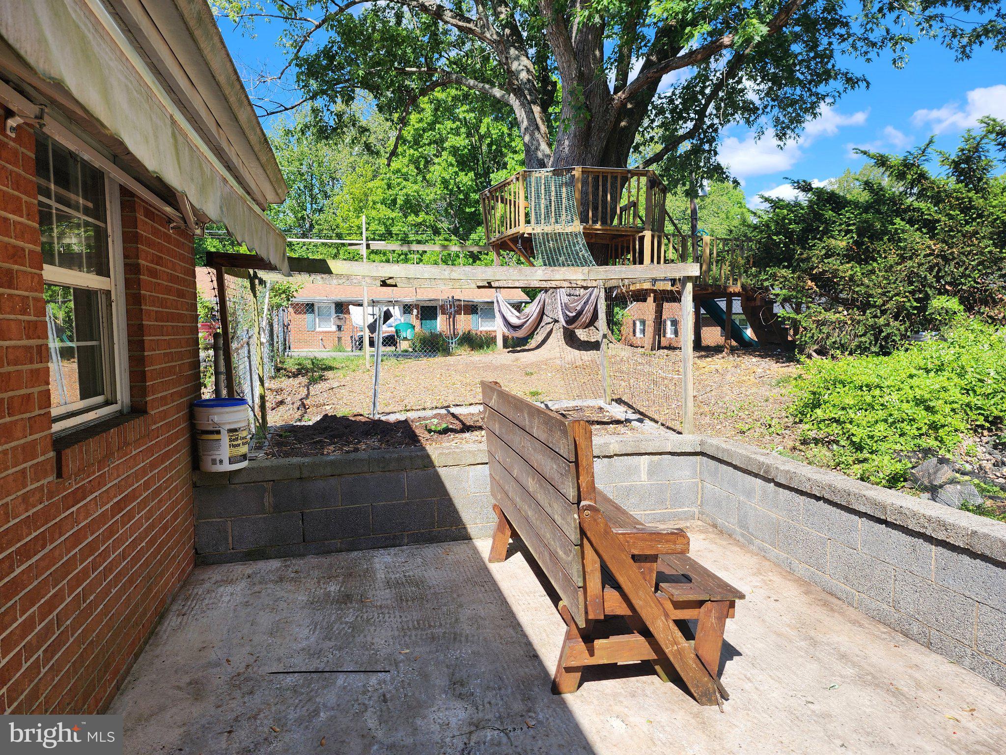 13 Main Street Huntingtown, MD 20639 - Photo 30 of 32 Serene backyard retreat with greenery.
